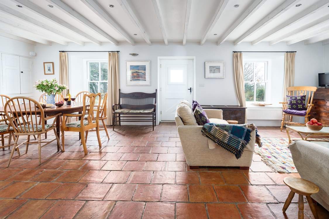 The snug with wood-burner and garden doors
